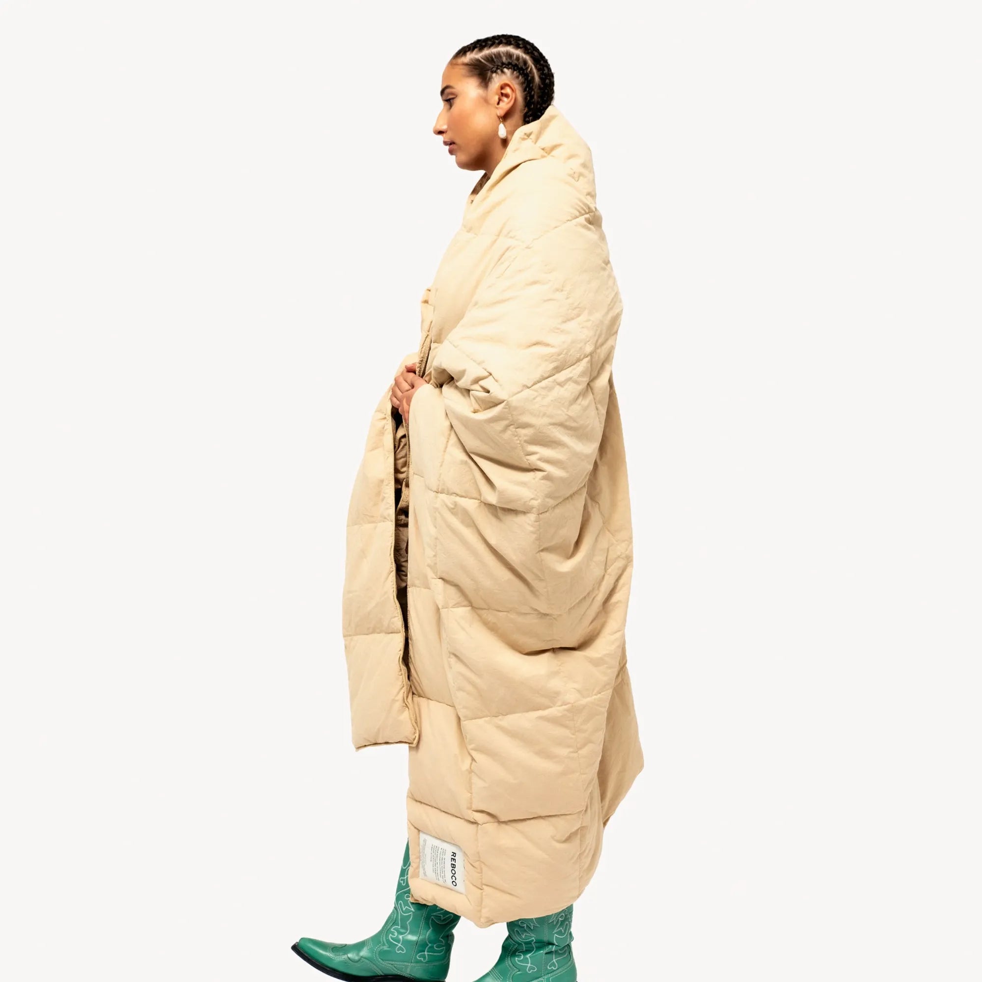 Luxurious biscuit-colored down blanket with fluffy texture
