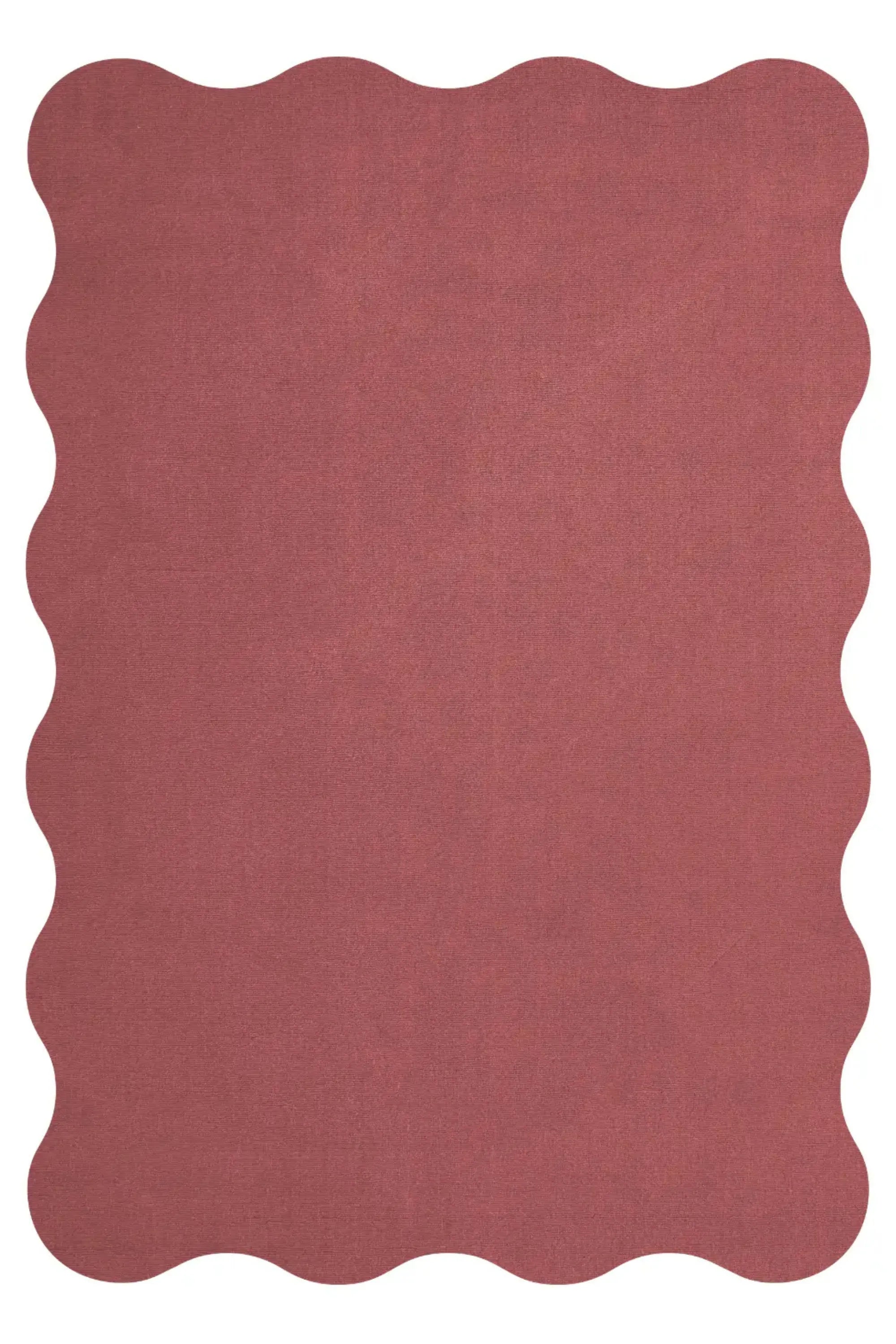 Tapis en laine festonnée