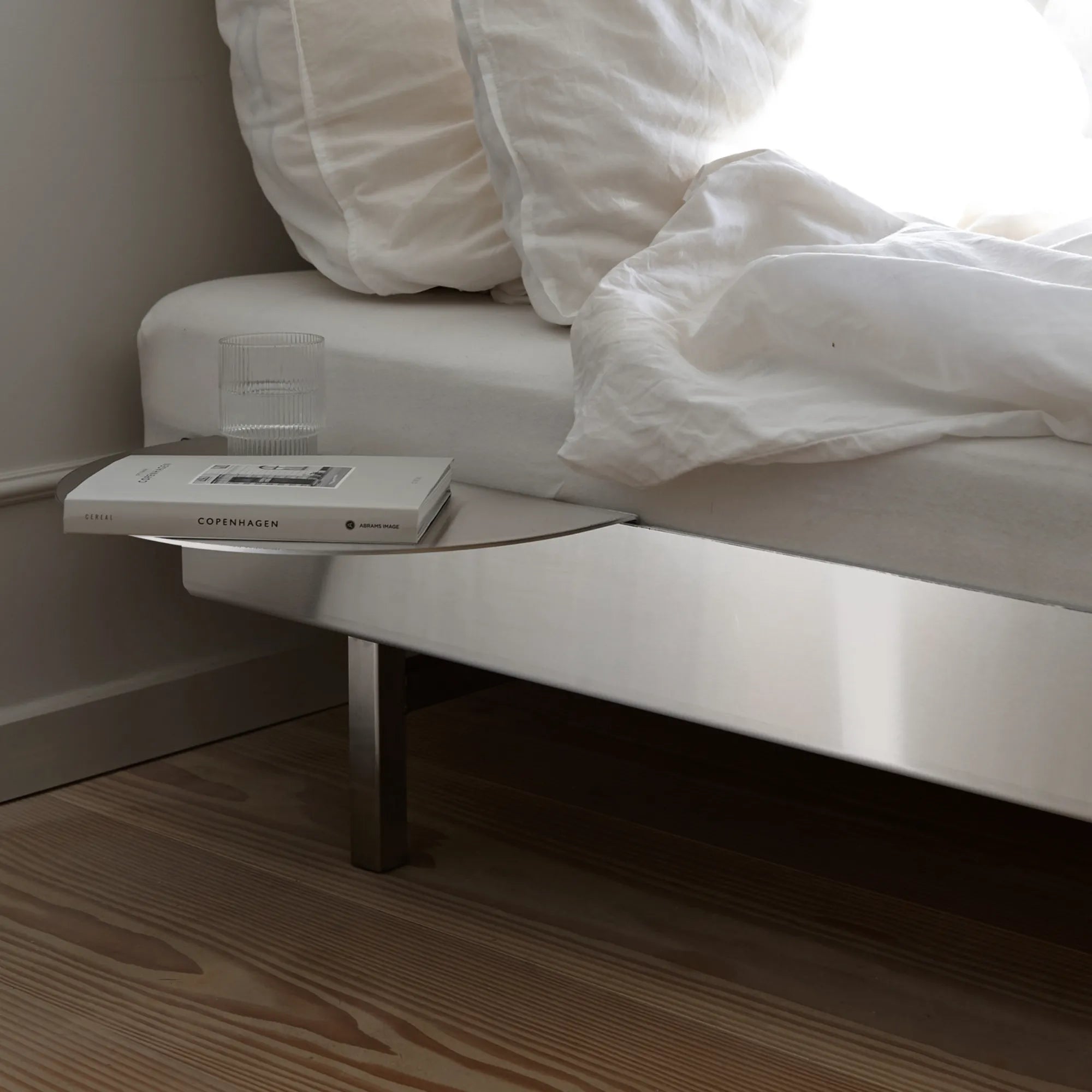 Elegant and modern stainless steel bed with adjustable headboard and built-in storage