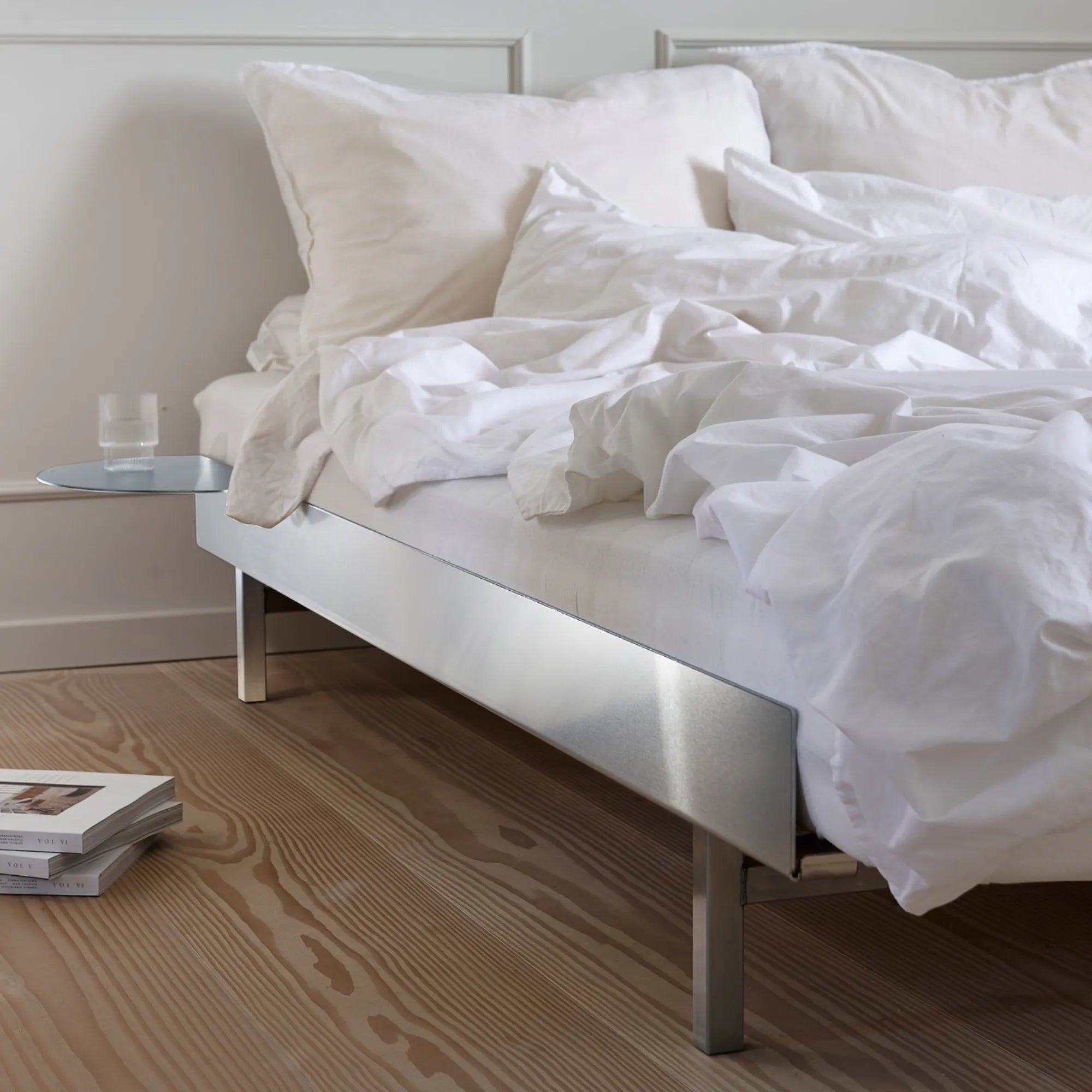 Luxurious stainless steel bed with comfortable mattress and stylish headboard