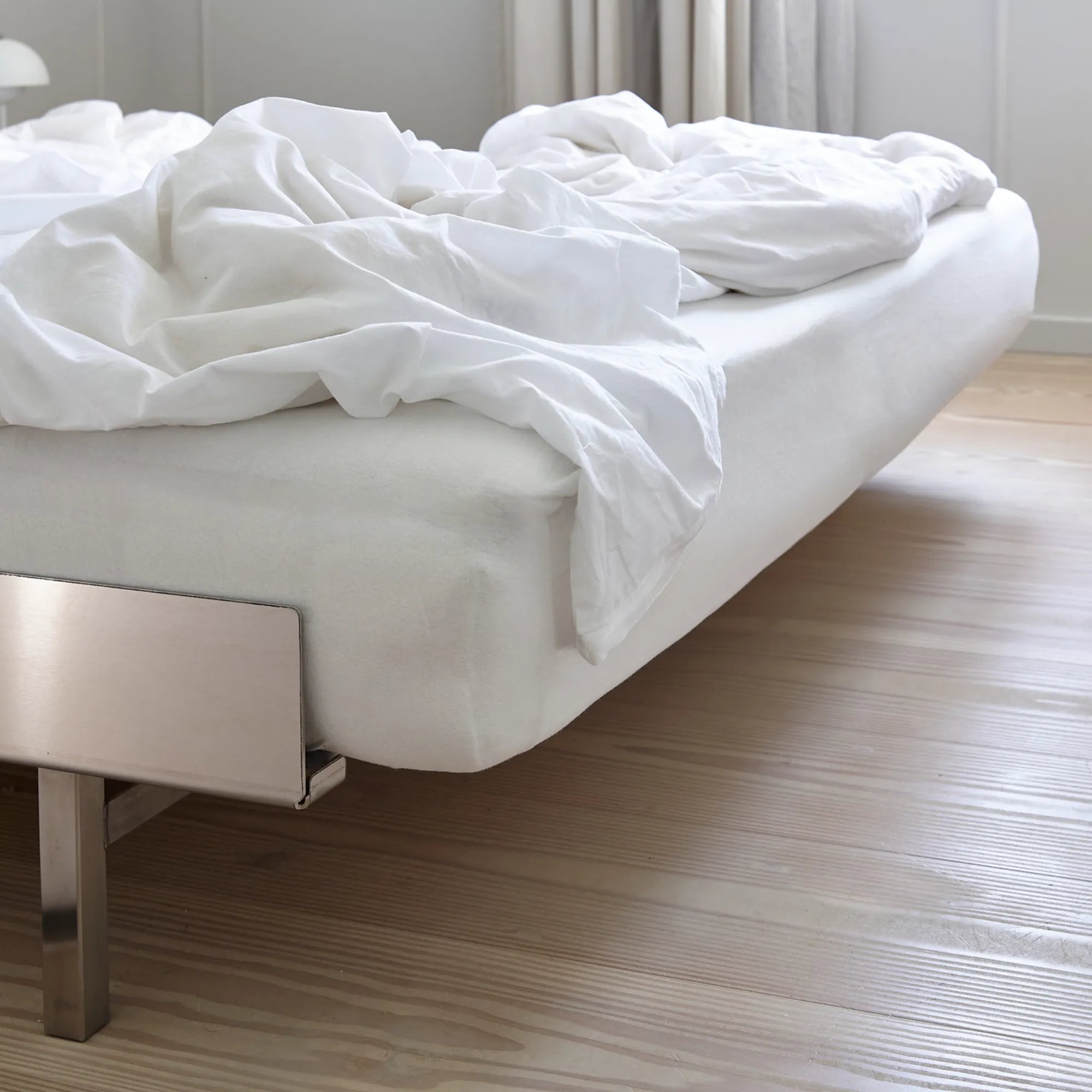 Chic and luxurious stainless steel platform bed with sleek and polished frame