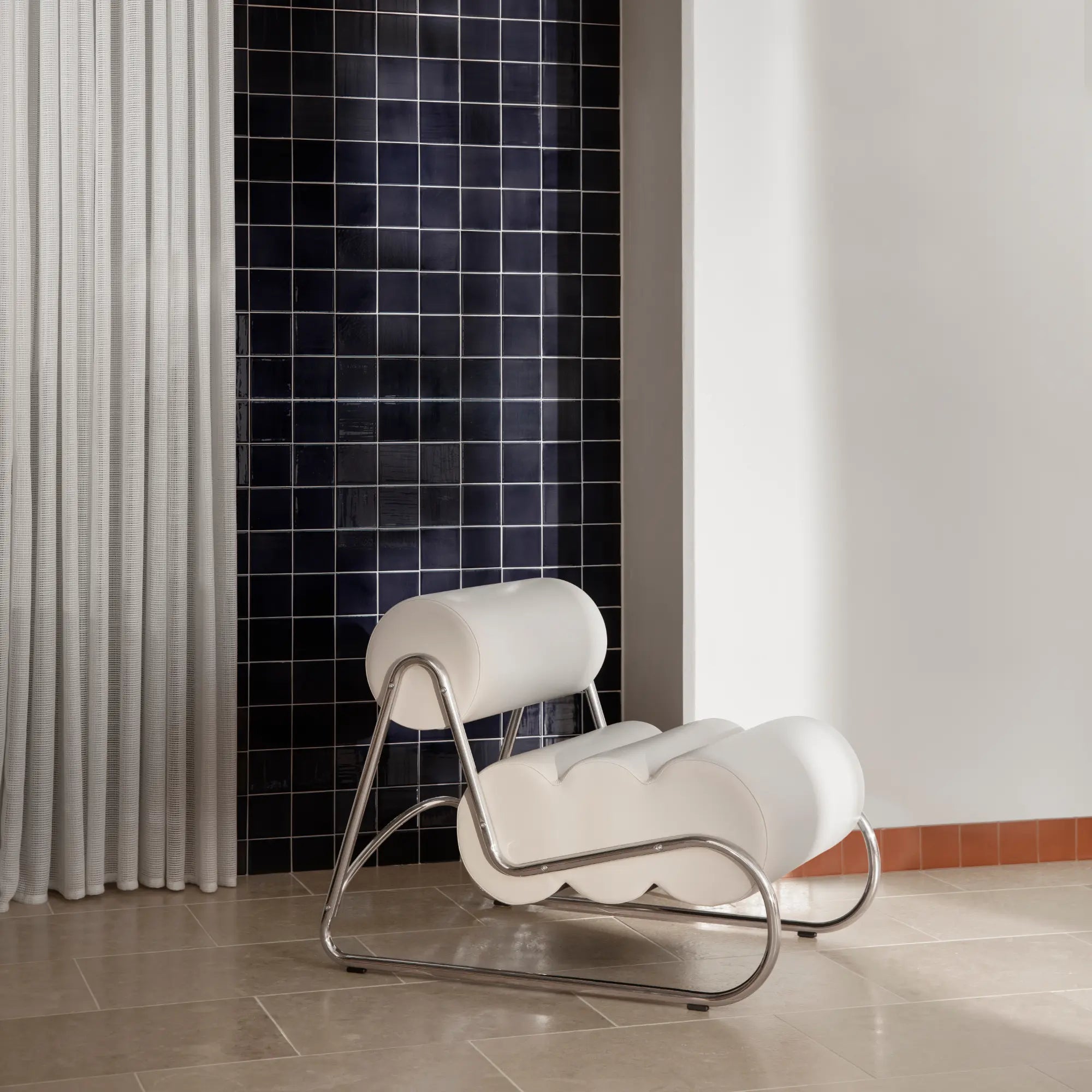 Fave Footstool offering comfortable and stylish extra seating in a bedroom