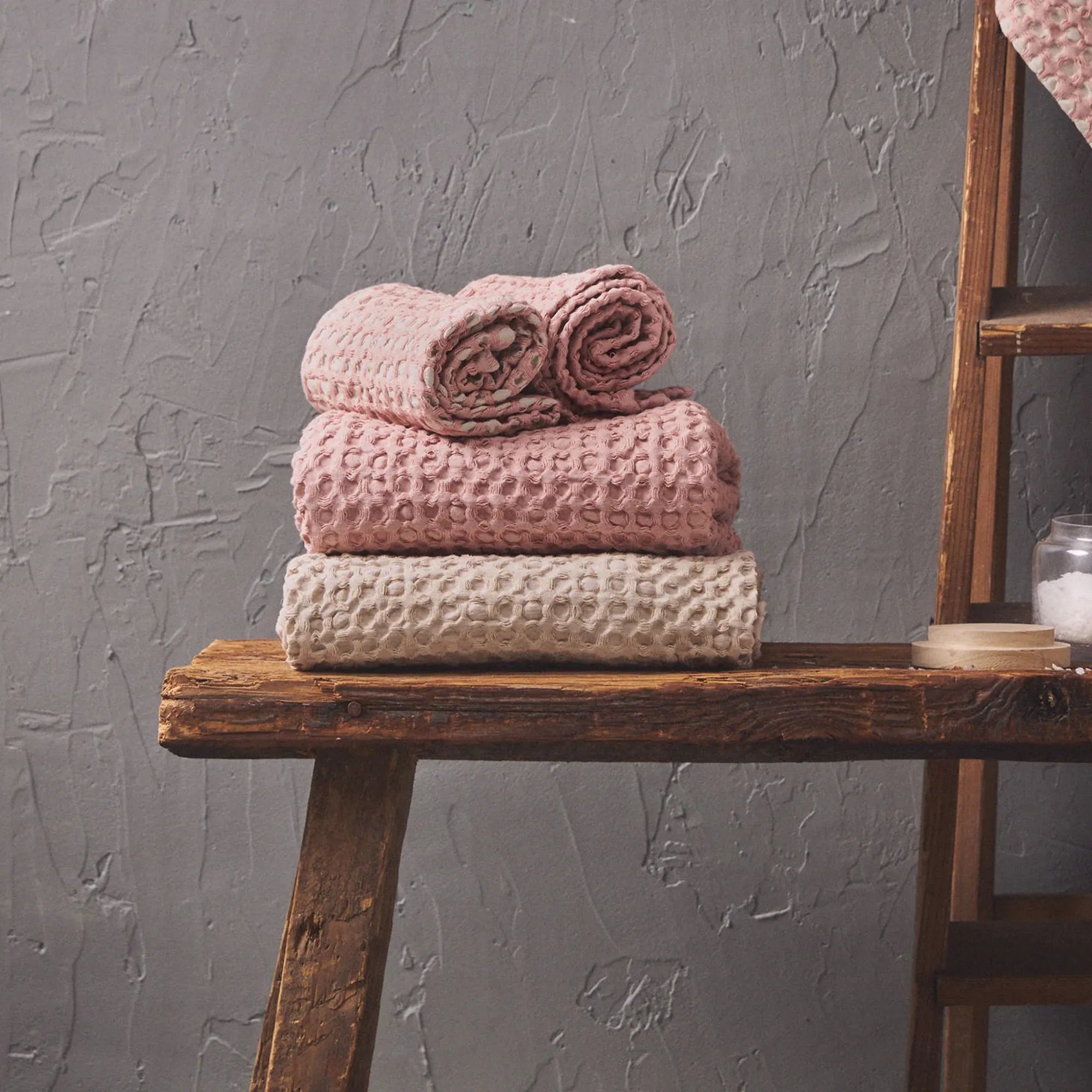 Puro Towel Set in luxurious white and grey colors, made of soft and absorbent cotton material, perfect for a spa-like experience at home