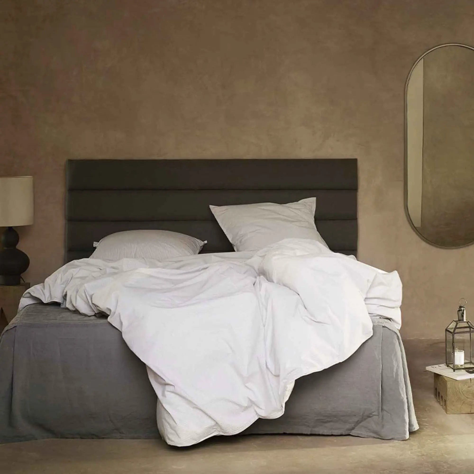 Beautiful linen headboard in neutral color, perfect for adding a touch of elegance to any bedroom decor