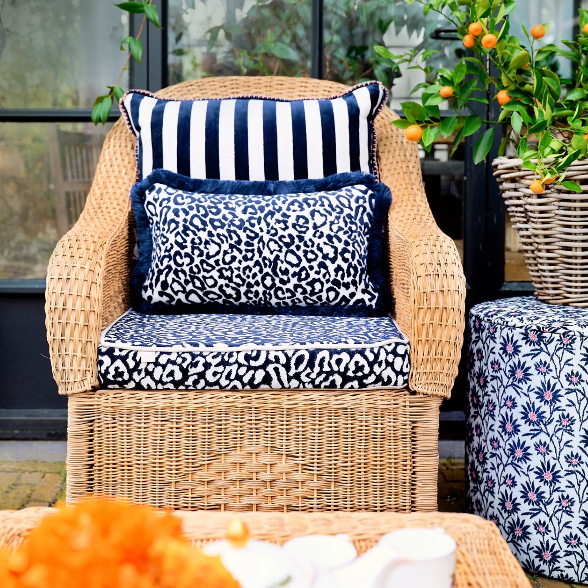 Round beige Mako Pouf with woven texture, perfect for living room seating