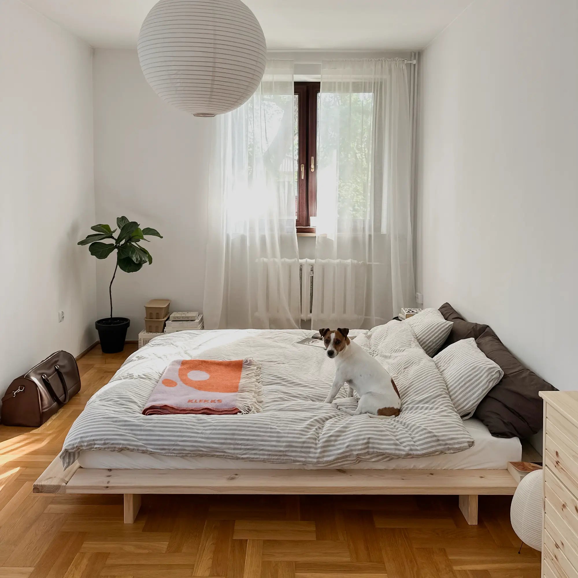 Handcrafted Japan Bed made from raw, untreated wood for a natural, minimalist look and feel in a modern bedroom setting