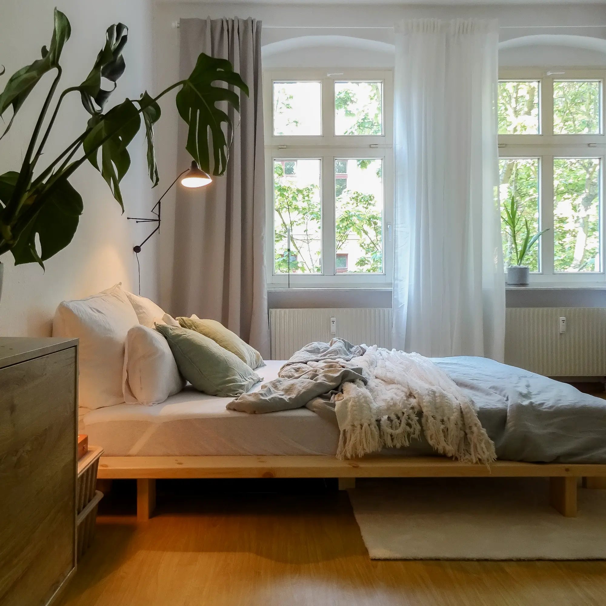 A traditional Japanese-style bed made from raw wood, featuring a low, minimalist design and clean lines for a serene and natural sleeping space
