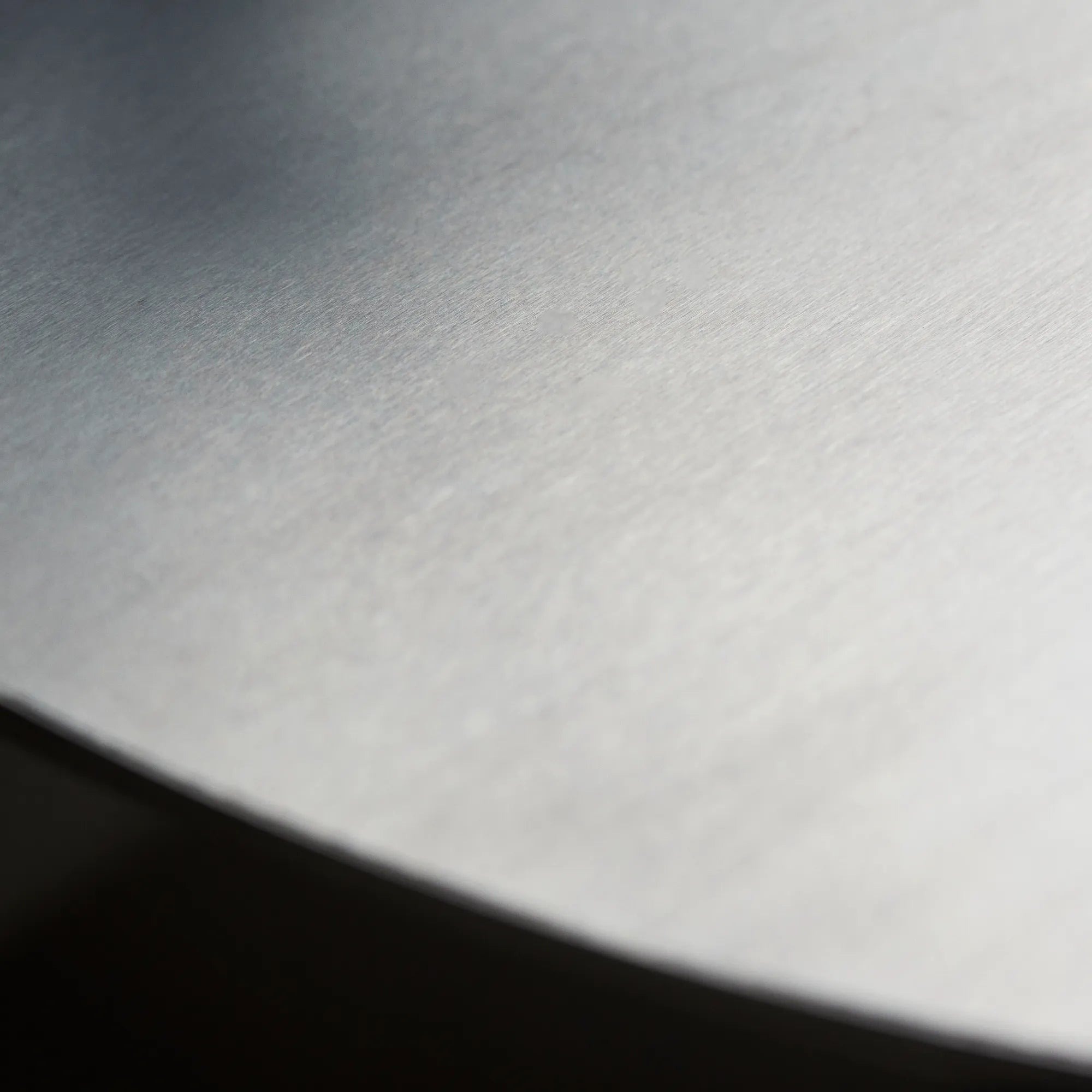 Sophisticated stainless steel bed with minimalist design and upholstered headboard