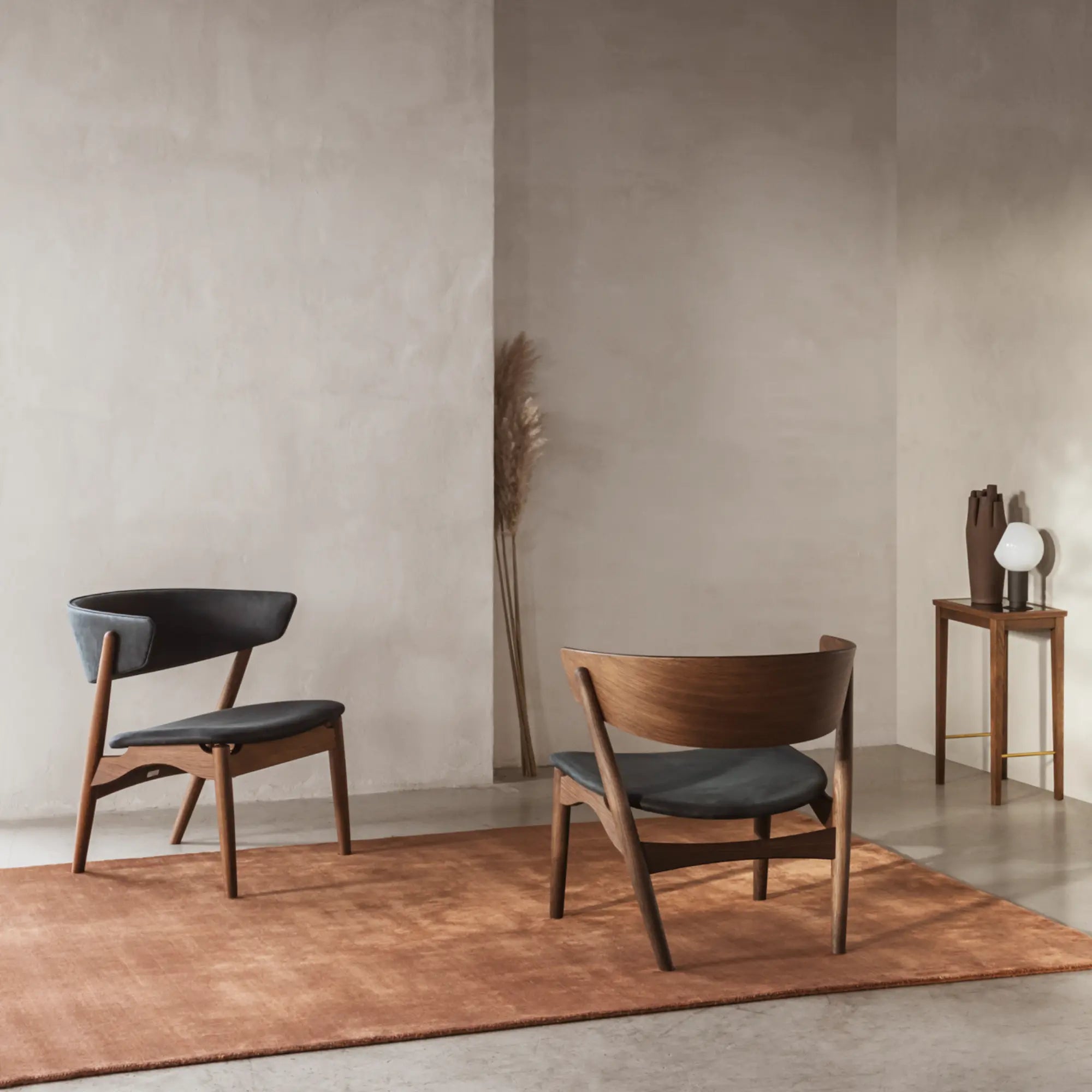 A luxurious and modern No 7 Lounge Chair in elegant black leather