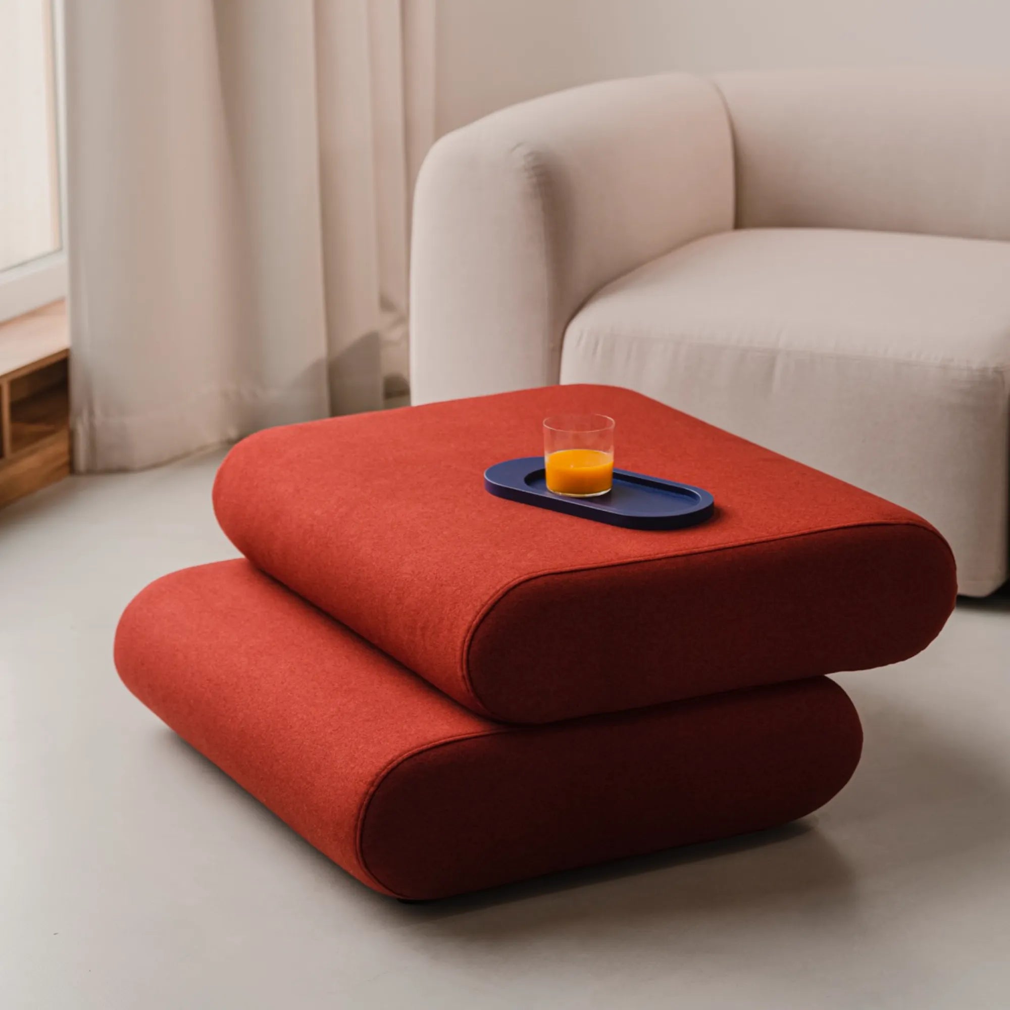 Taso Pouf in stylish geometric patterned fabric, adding visual interest