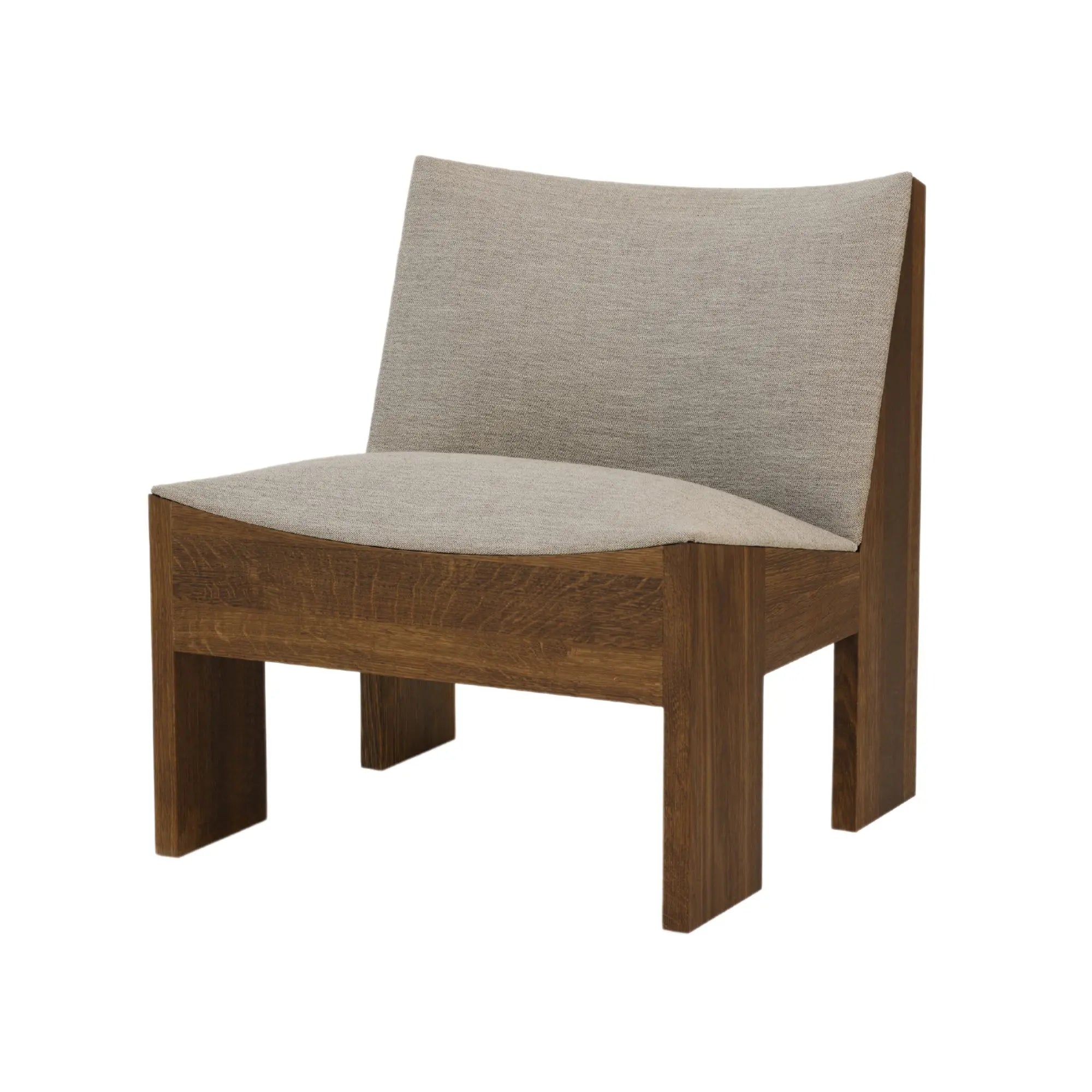  Tenon armchair in a stylish living room setting with decorative throw pillows