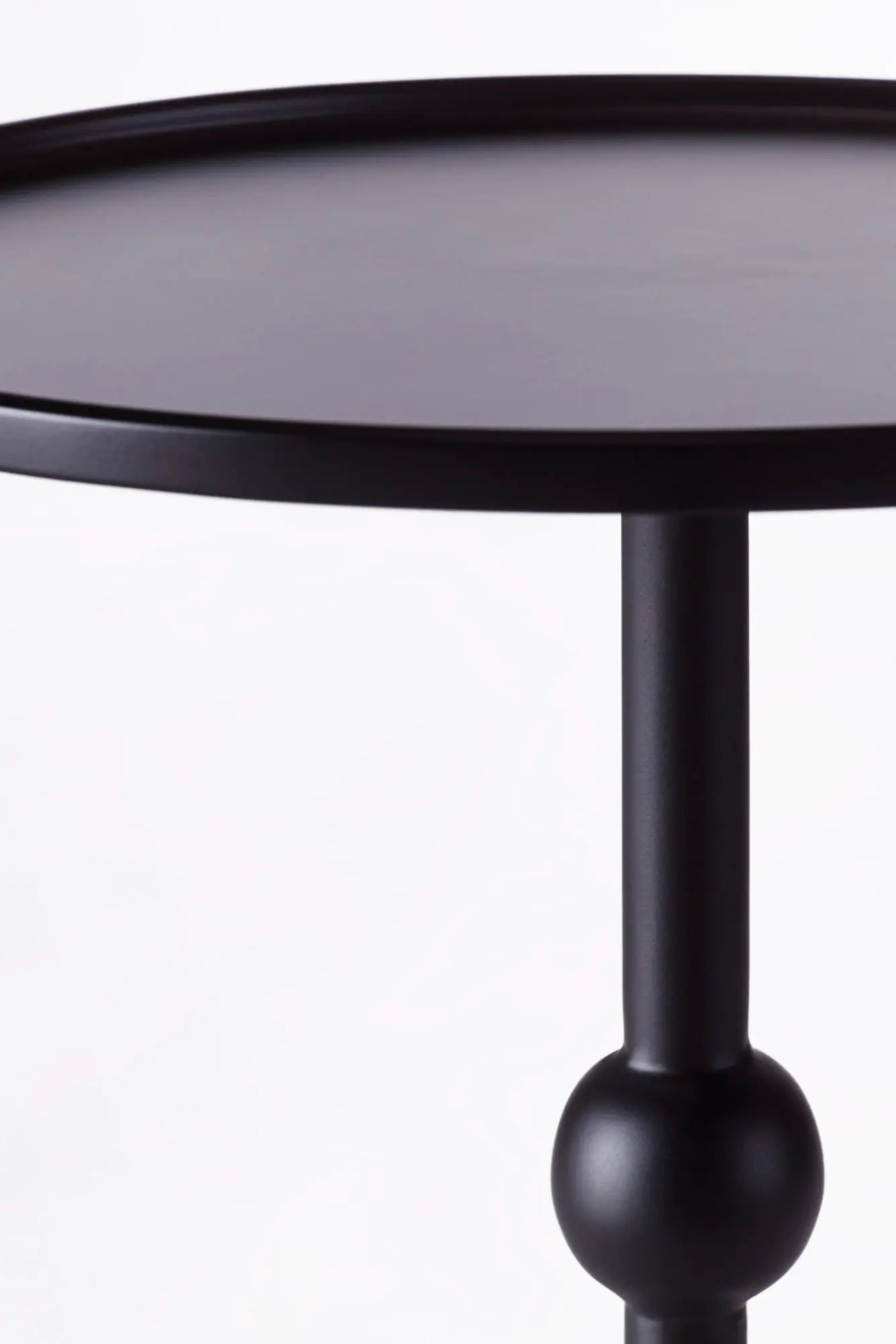 Dusty Martini Table displayed in a modern living room setting with a vase and books