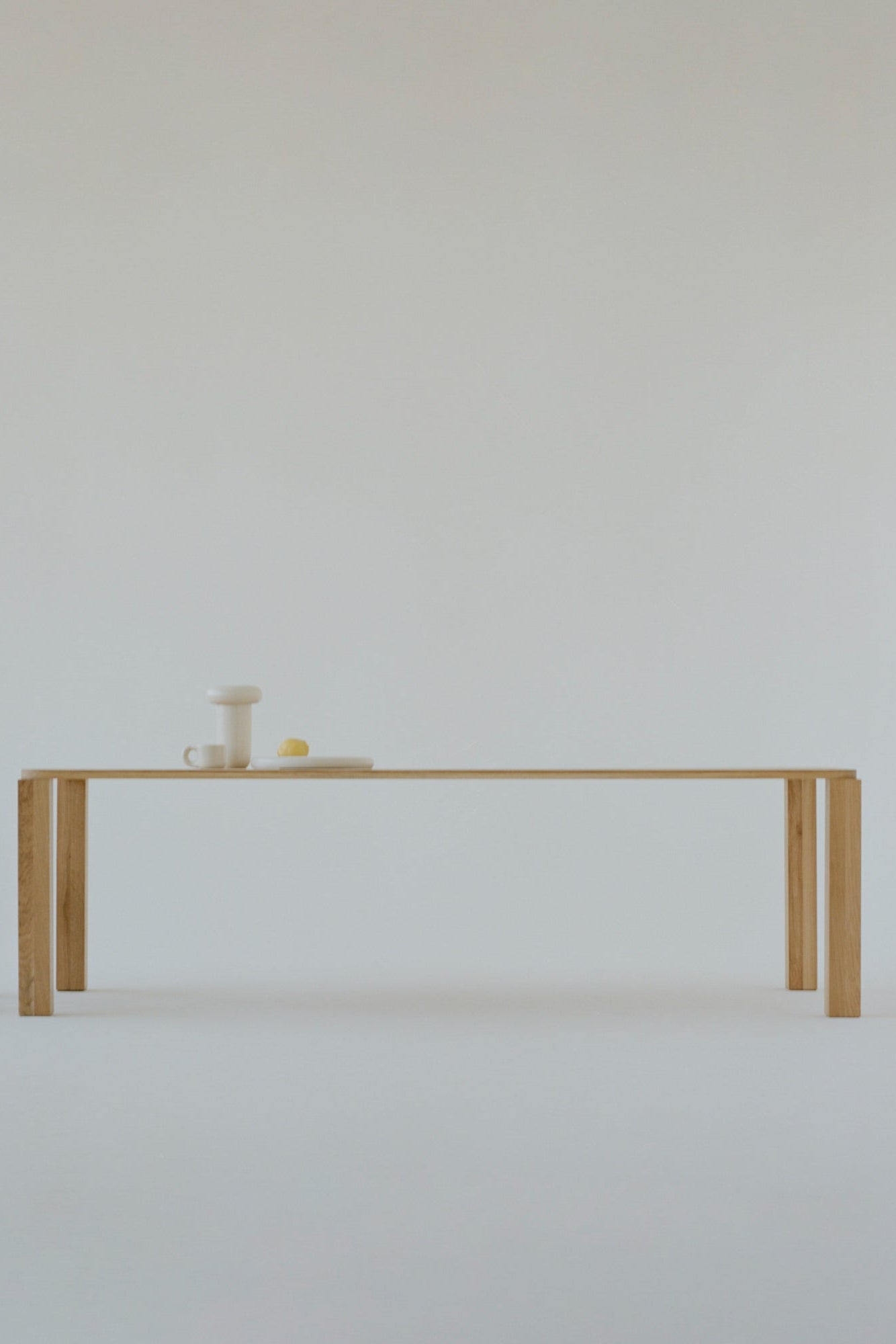  Luxurious round dining table with glass top and sculptural base