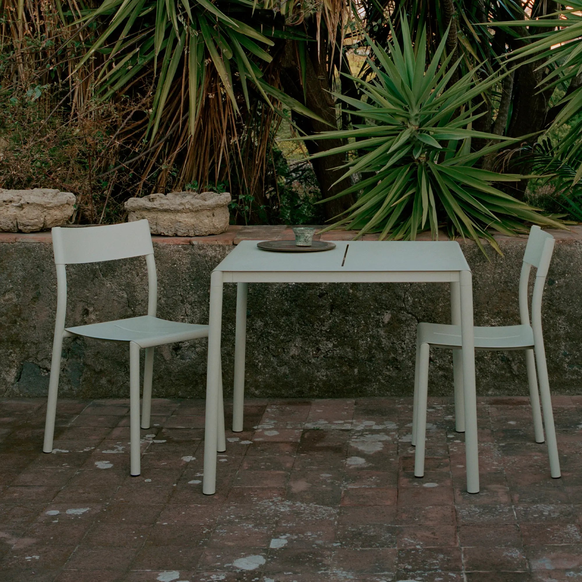  Close-up of outdoor may table showing intricate details of wood and metal