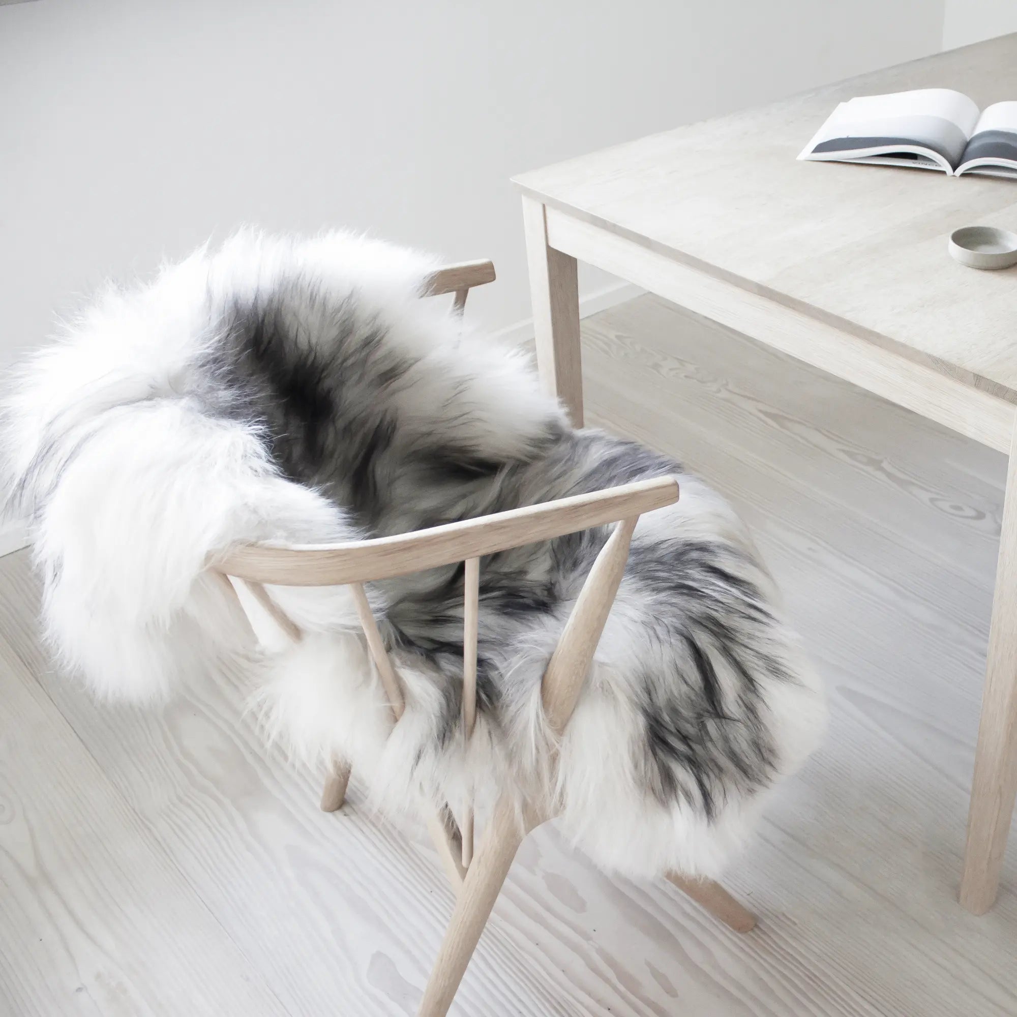 Natural sheepskin rug in luxurious ivory color with soft, dense wool texture