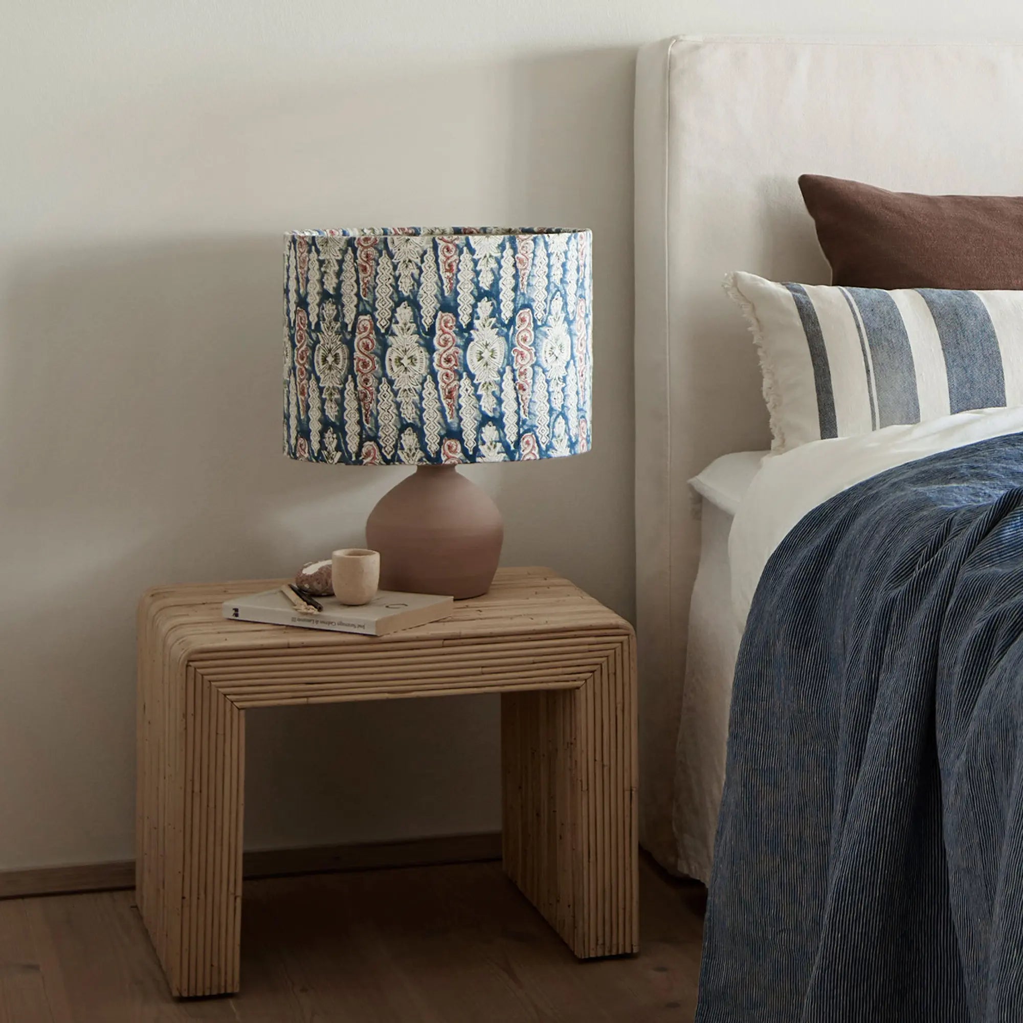 Hand-woven rattan side table with intricate geometric design and sturdy construction