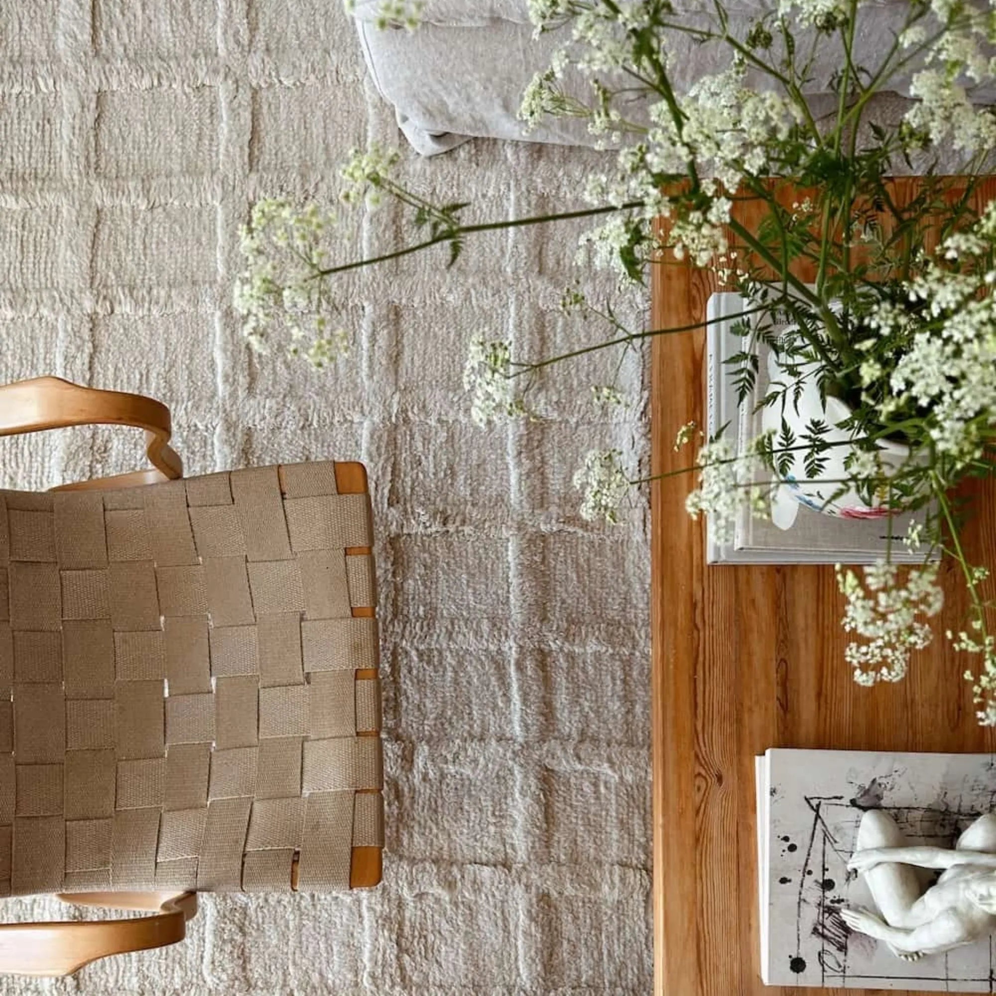 Hand-woven Badal Wool Rug featuring intricate geometric patterns in earthy tones