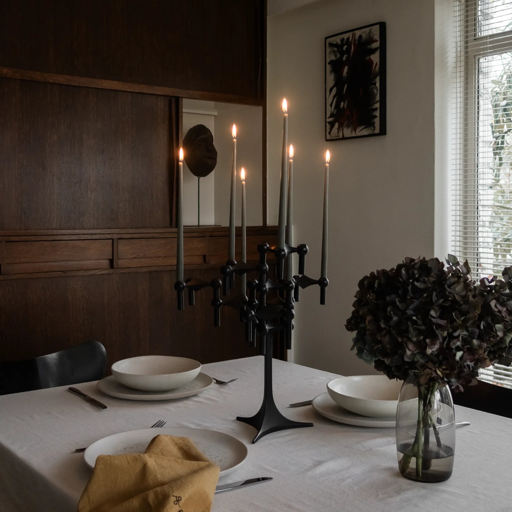 Modern and versatile candle holder with interchangeable parts in sleek black